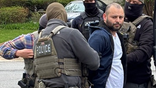 Marvin Mateo-Alberto being taken into custody by officers from multiple agencies. (ICE)