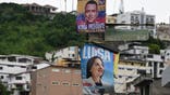 TOPSHOT - Banners with the image of Ecuador's President and Presidential candidate Daniel Noboa (top) and leftist Presidential candidate Luisa Gonzalez are pictured on a street in Guayaquil, Ecuador on April 11, 2025. Ecuador will hold Presidential runoff on April 13. (Photo by Raul ARBOLEDA / AFP) (Photo by RAUL ARBOLEDA/AFP via Getty Images)