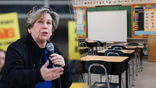 Randi Weingarten holding a microphone (Left) School desks lined up in a classroom (Right)
