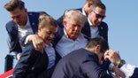 Donald Trump is rushed offstage by U.S. Secret Service agents