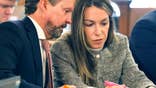 Defendant Karen Read and attorney Alan Jackson review jury questionnaires in the courthouse