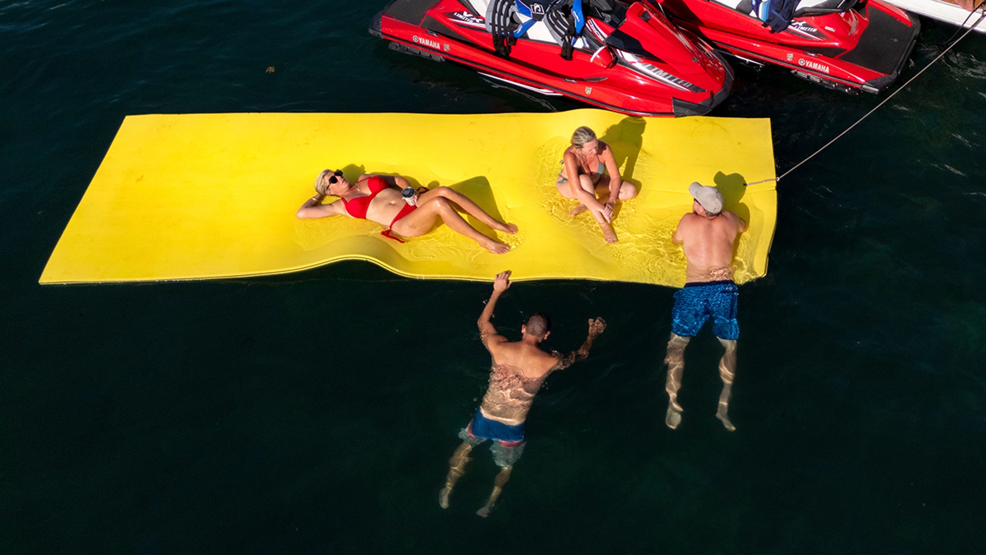 Spring breakers on a lake float in Florida.
