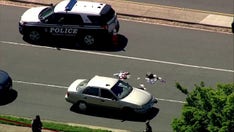 Virginia police officers shot during traffic stop near popular shopping center; suspect killed