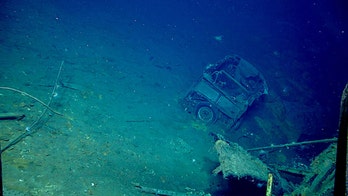 Divers discover vintage car in WWII shipwreck