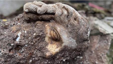 Archaeologists unearth strange head depicting Roman god beneath Catholic basilica