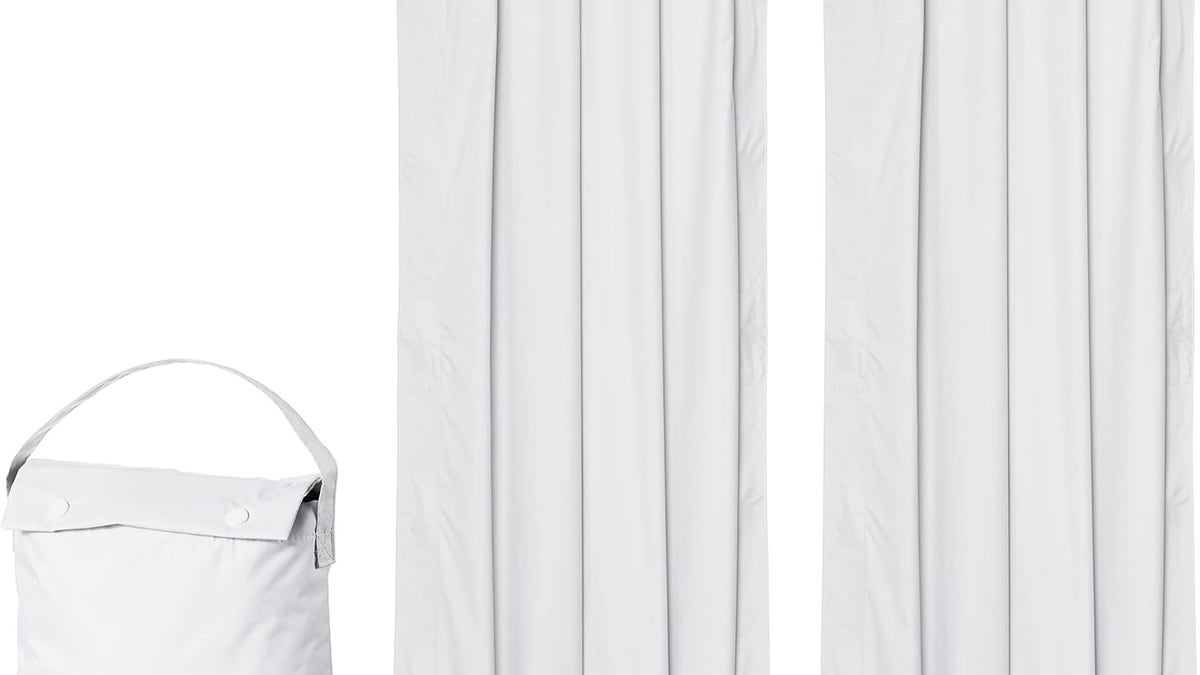 White Amazon basics blackout curtains on a white background