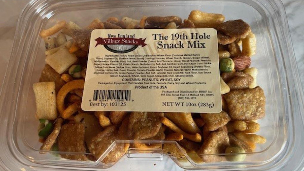 A 10-ounce container of the 19th Hole Snack Mix from New England Village Snacks.