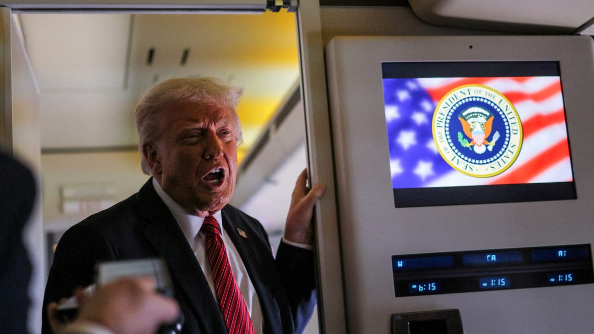 U.S. President Donald Trump speaks to the press on board Air Force One en route to Doha, Qatar, May 14, 2025