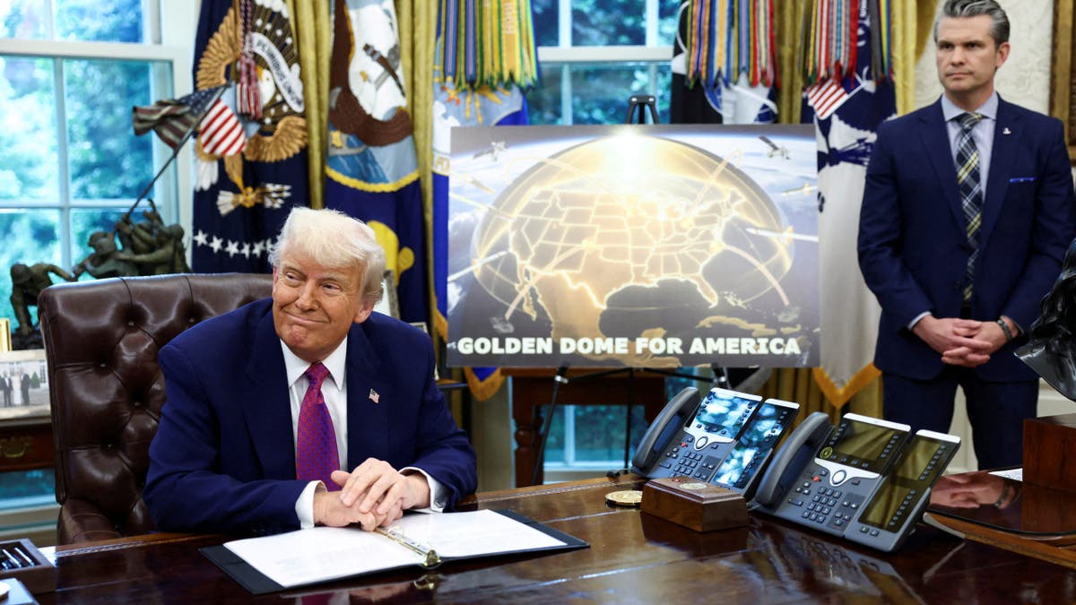 U.S. President Donald Trump makes an announcement regarding the Golden Dome missile defense shield next to U.S. Defense Secretary Pete Hegseth in the Oval Office of the White House in Washington, D.C., U.S., May 20, 2025.
