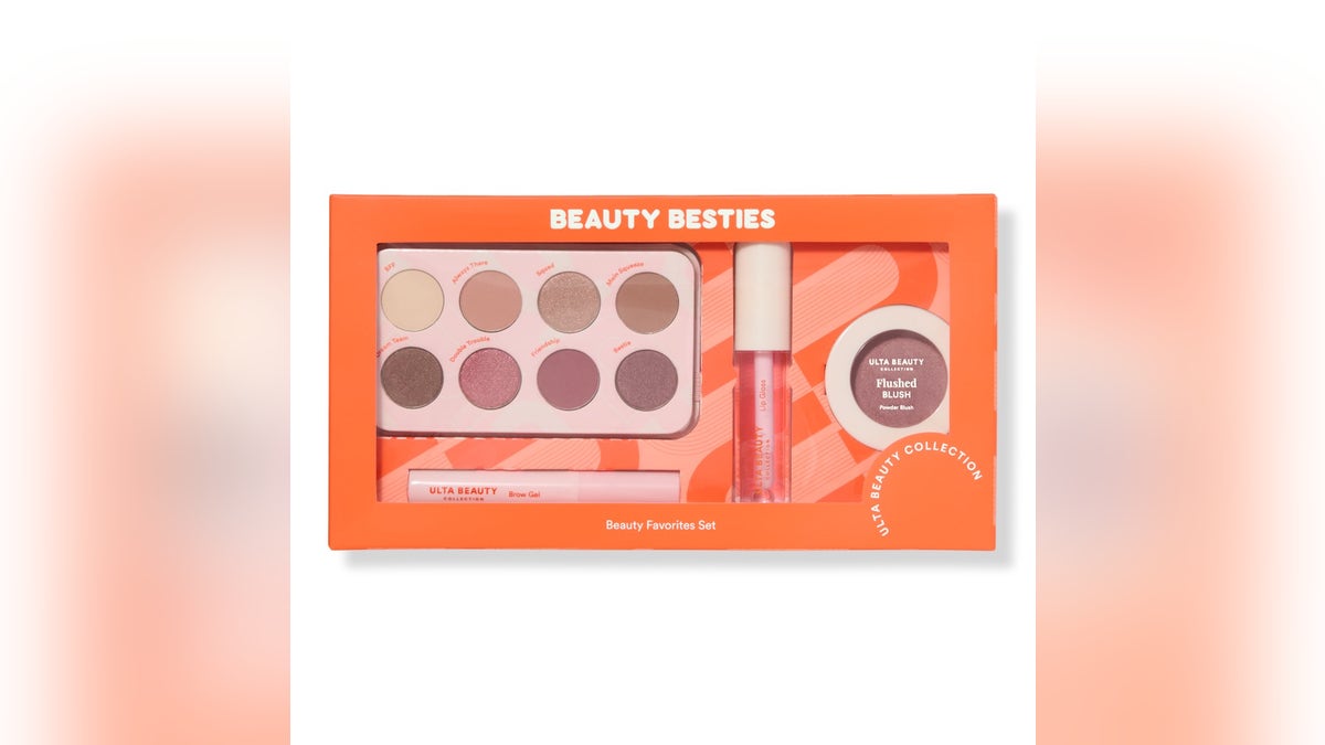 A curated set of makeup essentials in an orange box