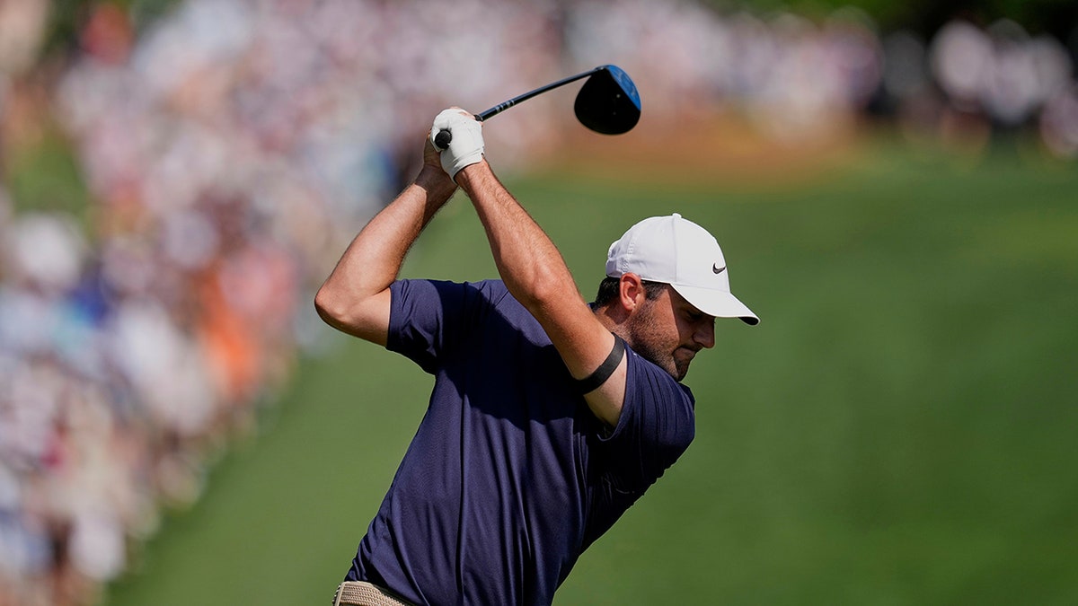 Scottie Scheffler hits a tee shot