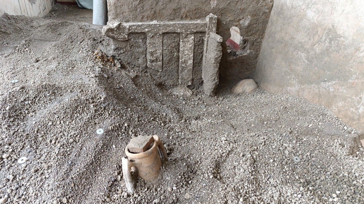 Excavation artifacts covered with ash