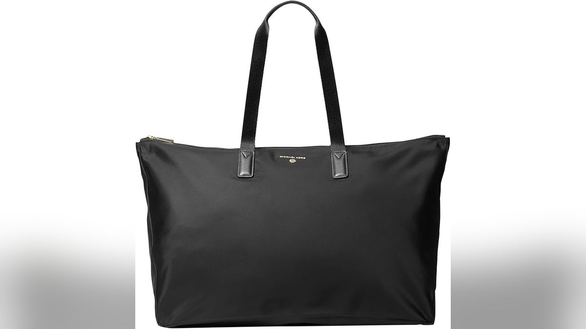 A black Michael Kors Jet Set travel tote