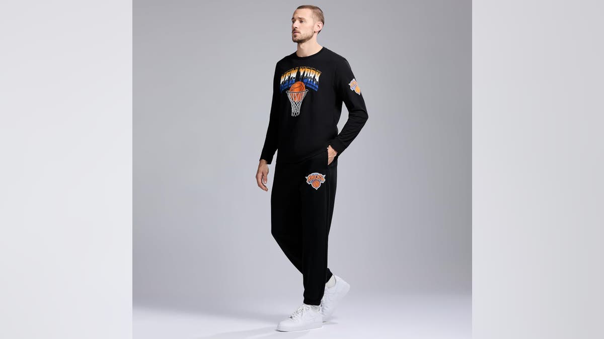 You'll look cool in this black long-sleeve Knicks shirt. 