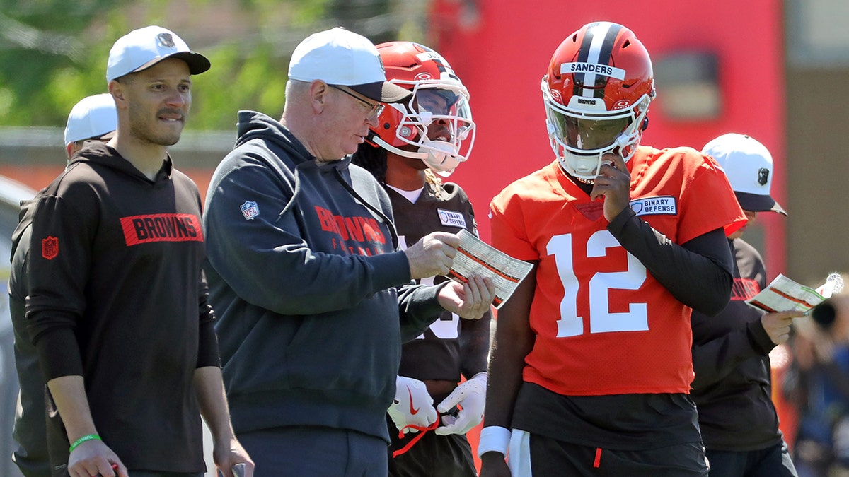 Shedeur Sanders looks on