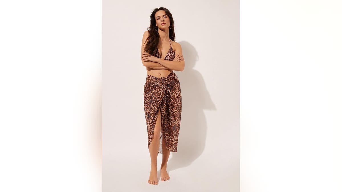 Liven up your beach fit with an animal-print Sarong. 