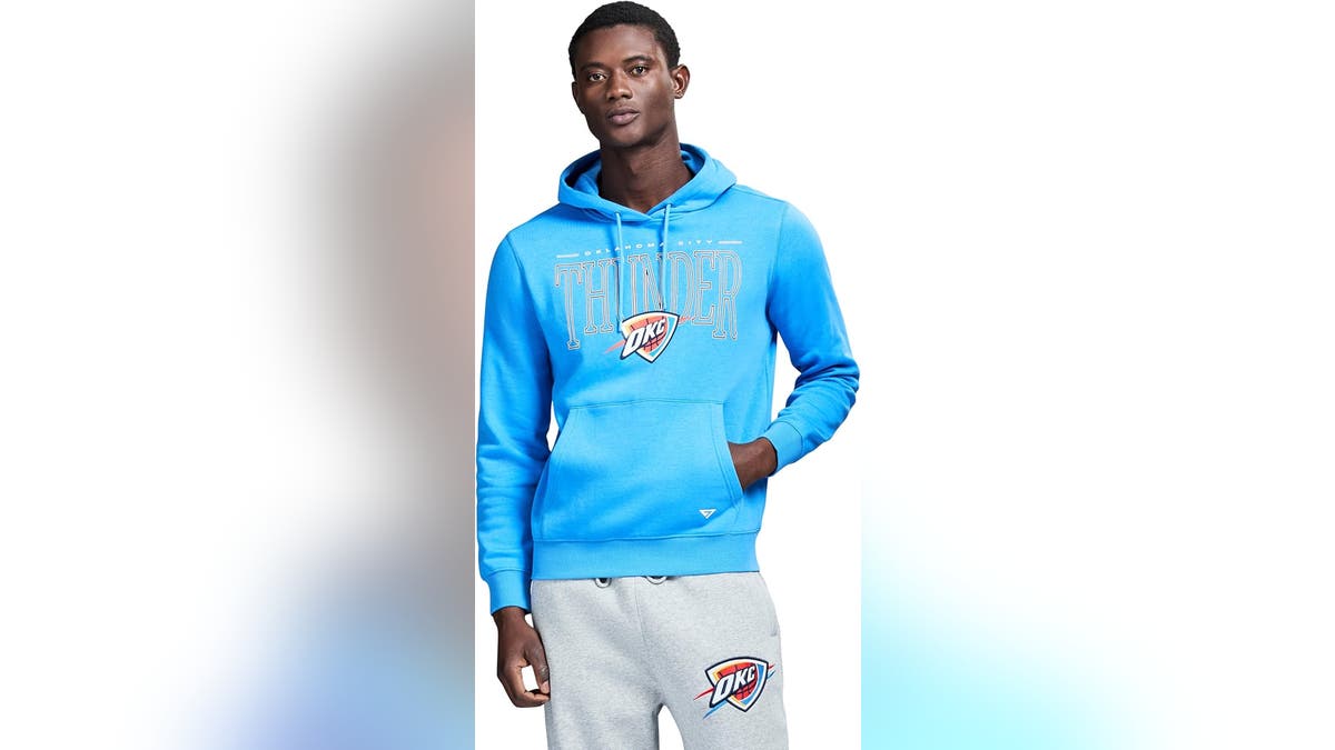 A bright blue sweatshirt with the Thunder logo. 