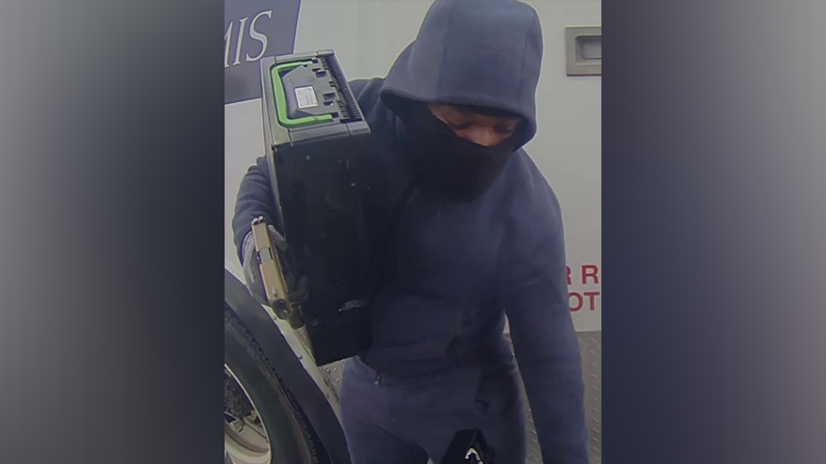Suspect with gun