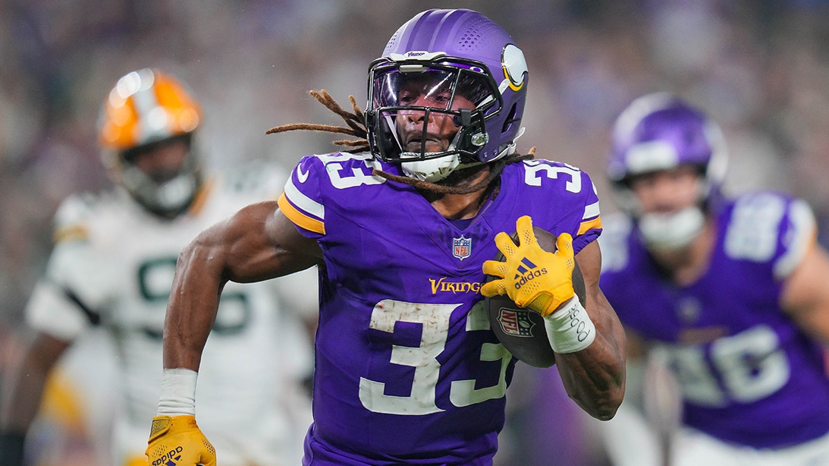 Aaron Jones runs away