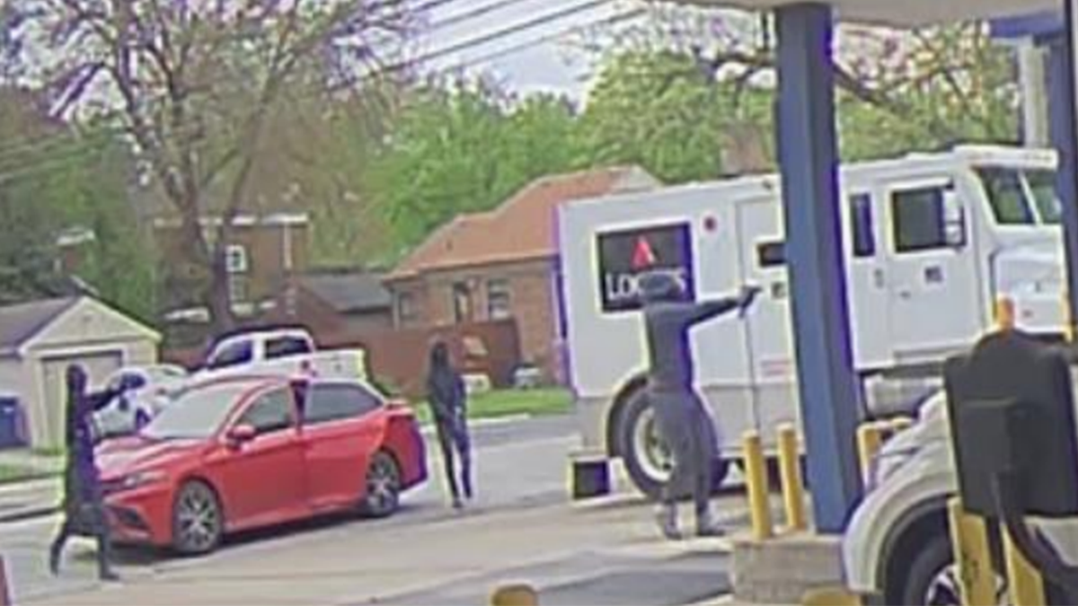 suspects pointing guns at truck