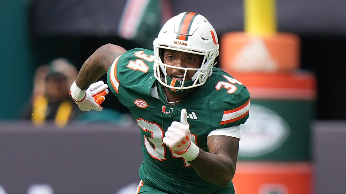 Adarius Hayes runs on field