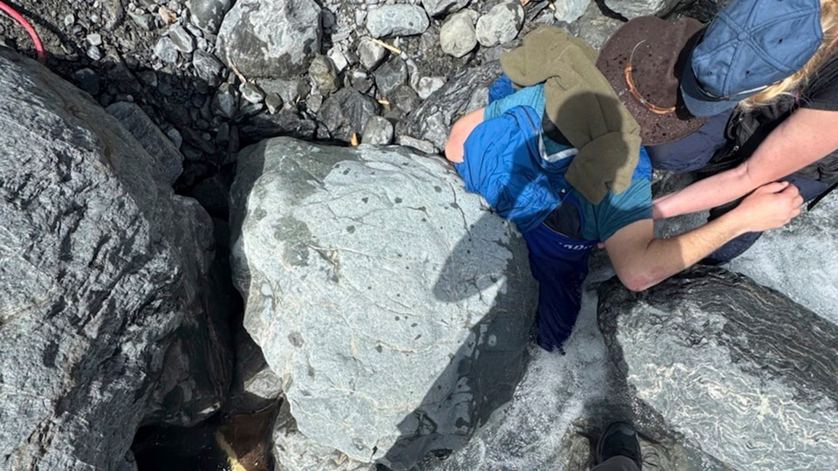 Trapped under boulder in Alaska