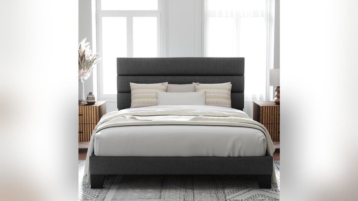 The Allewie Queen Size Platform Bed combines a soft fabric-upholstered headboard with a sturdy wooden slat support system.