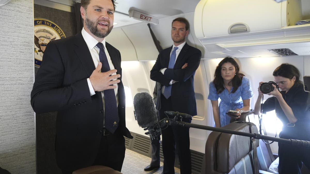 Vice President JD Vance talks to reporters on board Air Force Two at Leonardo da Vinci International Airport in Rome on May 19, 2025.
