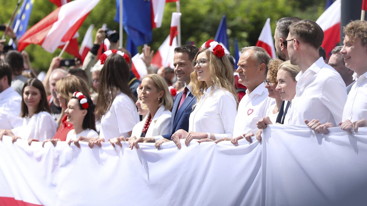 In Warsaw, Poland, on May 25, 2025, Donald Tusk, Prime Minister of Poland, participates in the ''Great Patriotic March'' organized in support of Rafal Trzaskowski, Civic Platform candidate for President of Poland. The march takes place through the streets of the capital. The Great Patriotic March, organized to show support for Civic Platform candidate Rafal Trzaskowski in the presidential election, proceeds through the streets of the capital. Polish Prime Minister Donald Tusk and the visiting President-elect of Romania, Nicusor Dan, attend the march. Some of the other candidates also participate. Rafal Trzaskowski faces Karol Nawrocki, supported by Law and Justice, in the second round of the election on June 1.