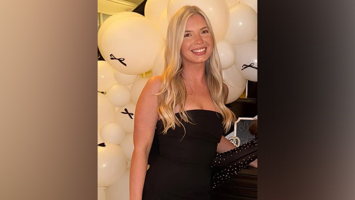 Ashlee Long in a strapless black dress