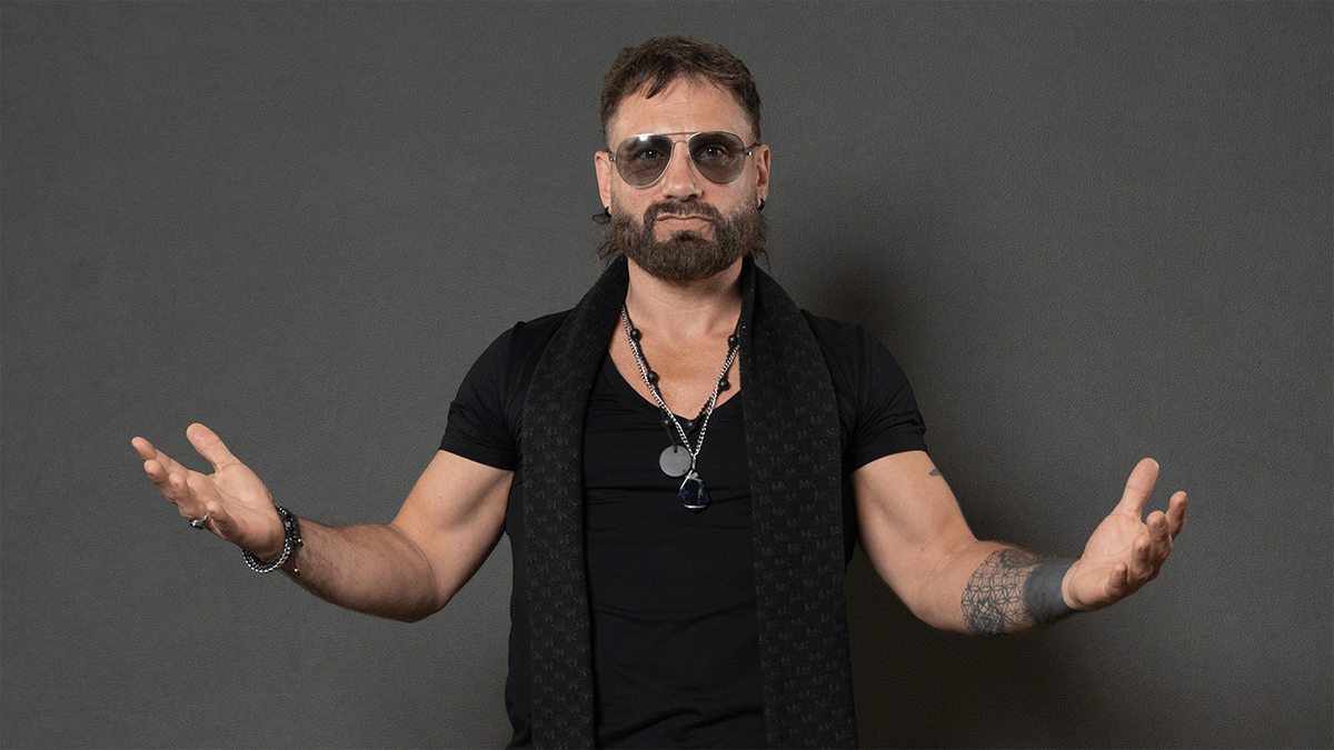 Austin Aries poses