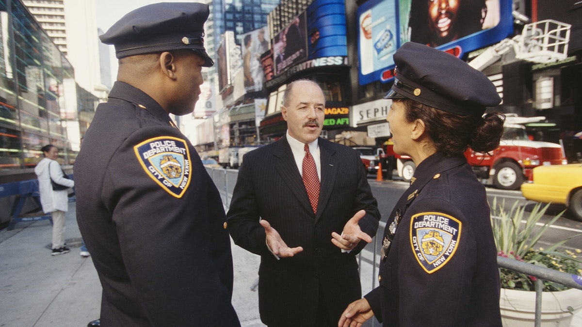 New York City Police Commissioner Bernard Kerik talking to police officers