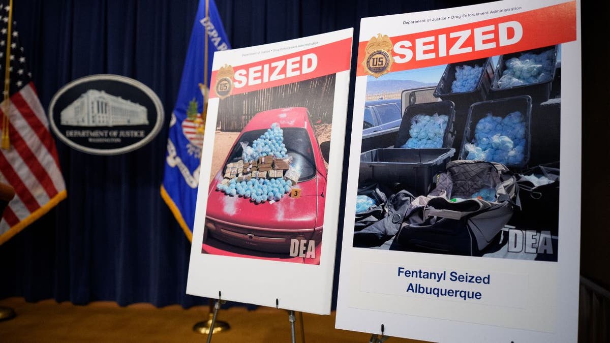 Posters depicting images of individuals arrested and firearms seized are displayed before U.S. Attorney General Pam Bondi arrives for a news conference