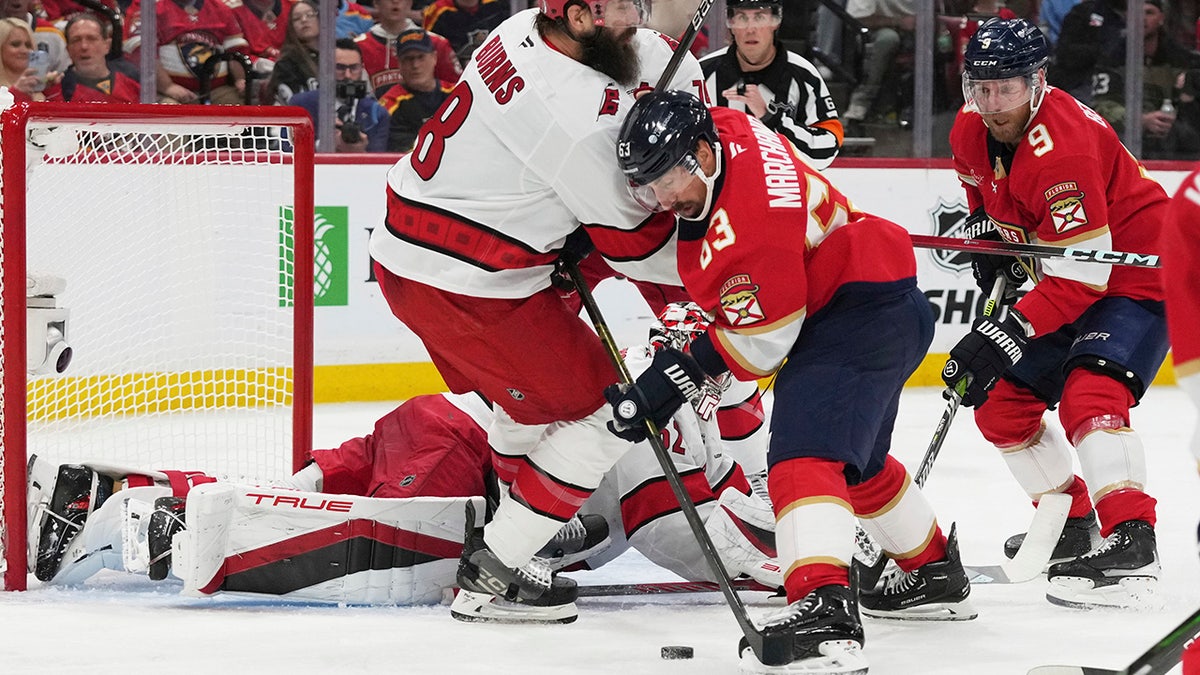 Brad Marchand fights for the puck