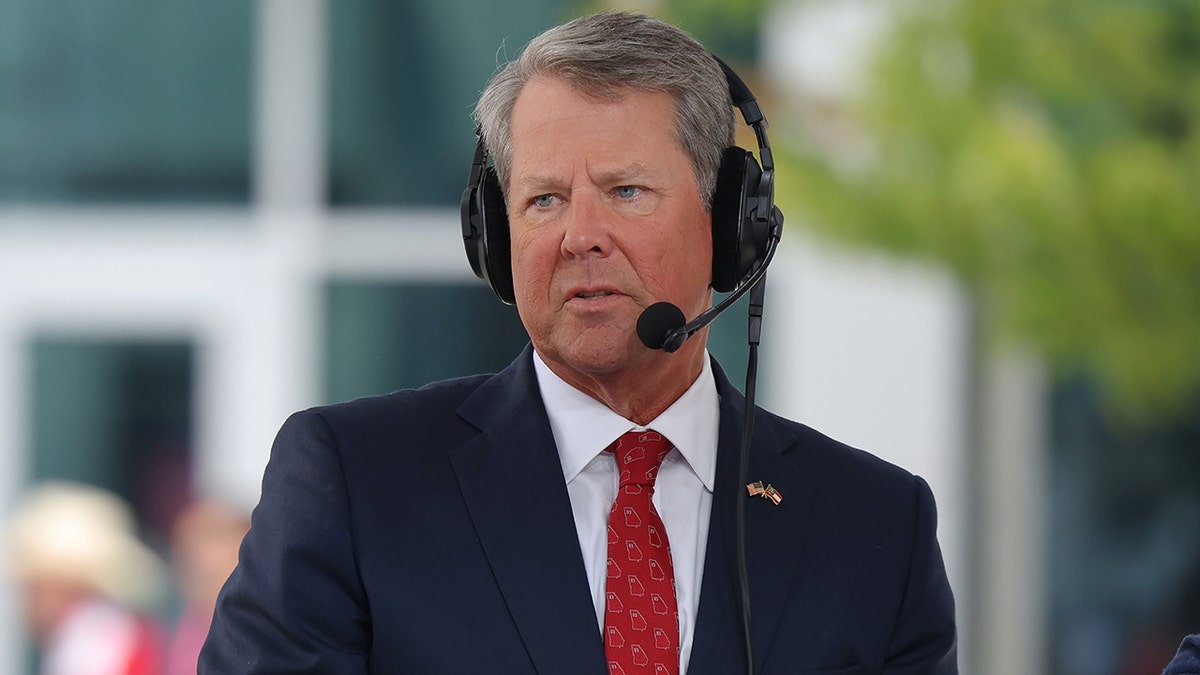 Georgia Gov. Brian Kemp wearing a headset