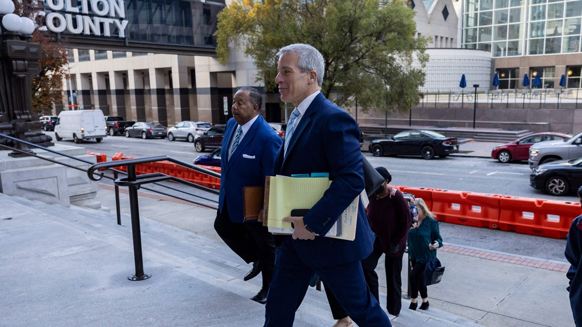 Brian Steel walks into Fulton County court
