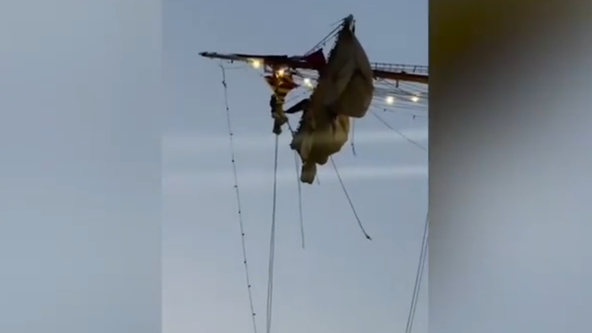 Crew members hanging onto Mexican Navy ship