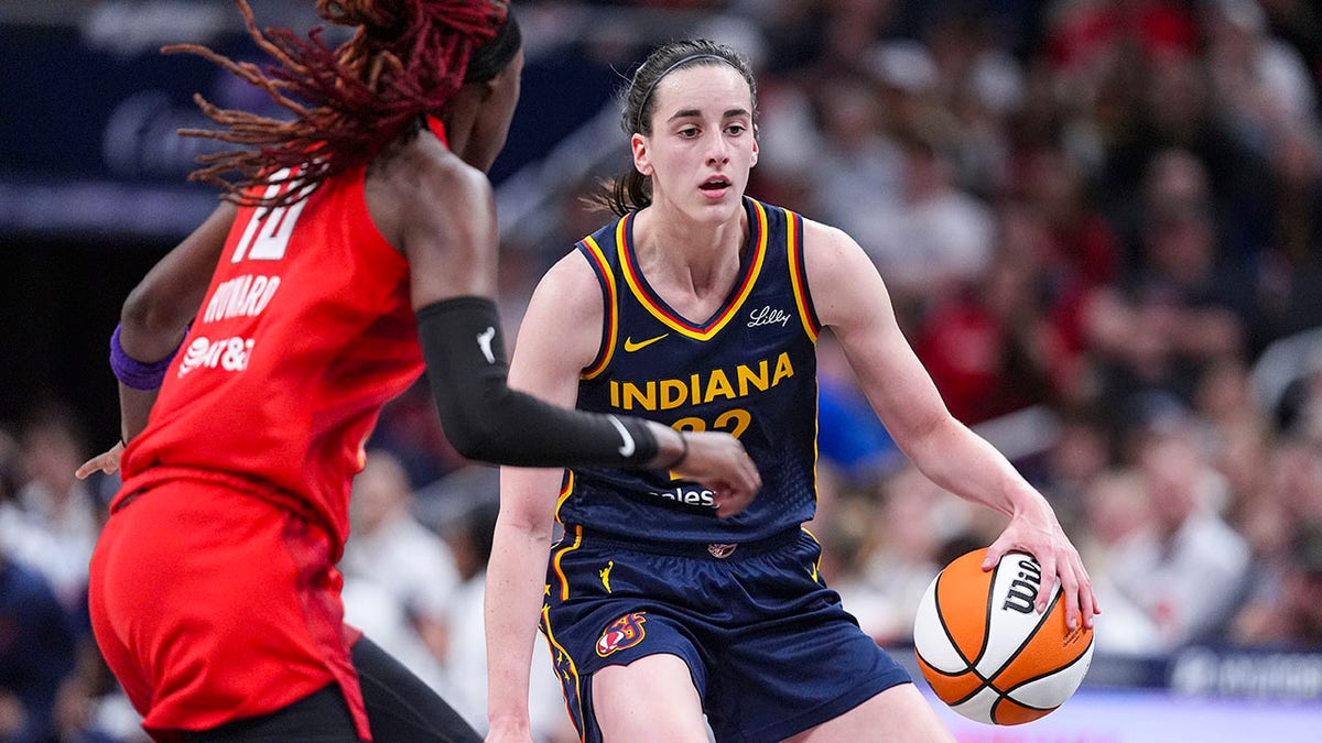 Caitlin Clark dribbles