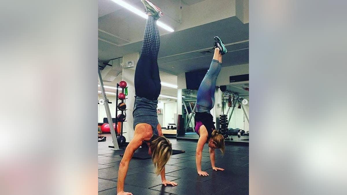 Candace Cameron Bure doing a handstand