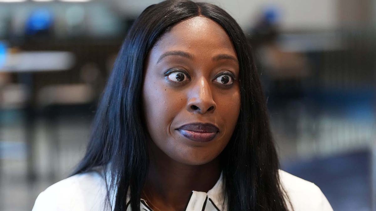 Chiney Ogwumike wearing a white blouse 