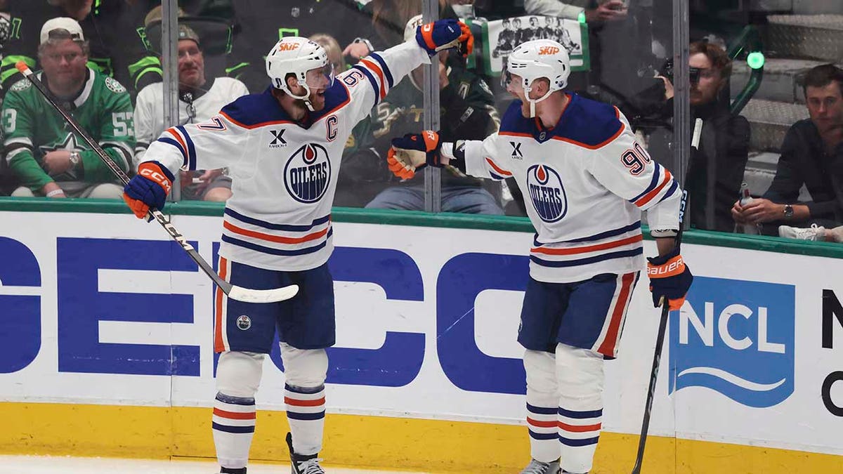 Corey Perry celebrates with Connor McDavid
