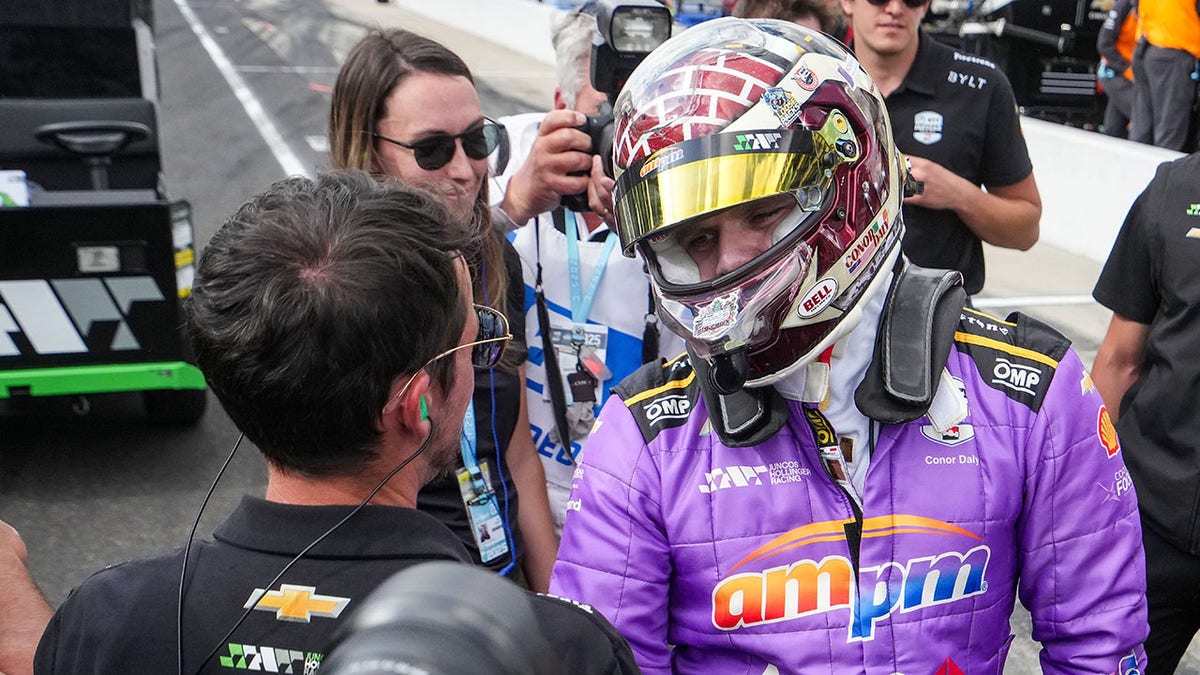 Conor Daly and a crew member