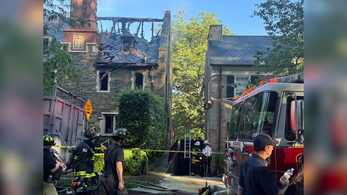 roof of mansion damaged and scorched after firefighters attend to scene