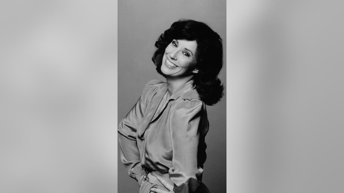 Denise Alexander smiling in a glamor shot