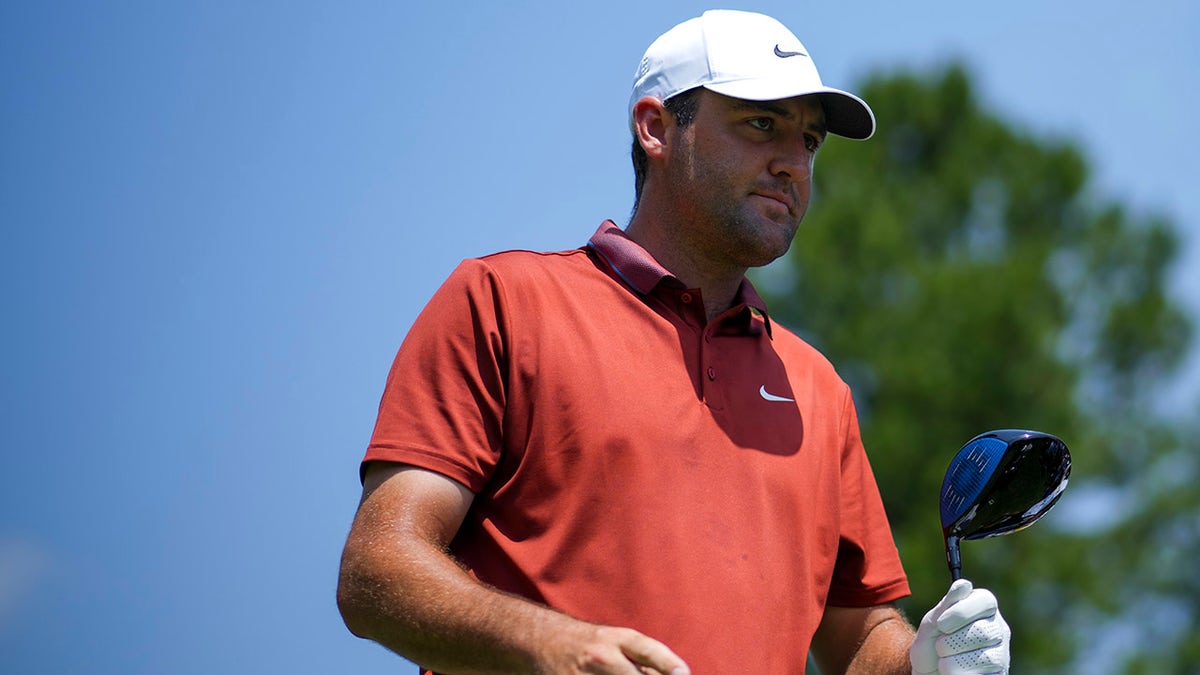 Scottie Scheffler walks on course