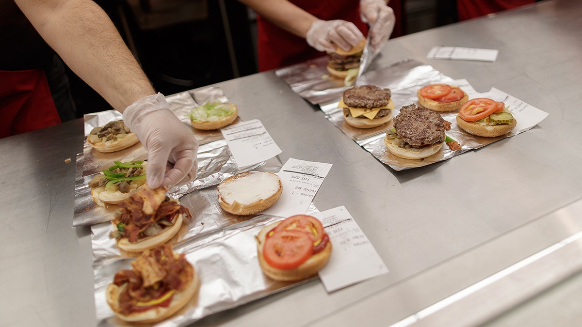 Five Guys burgers are being prepared.