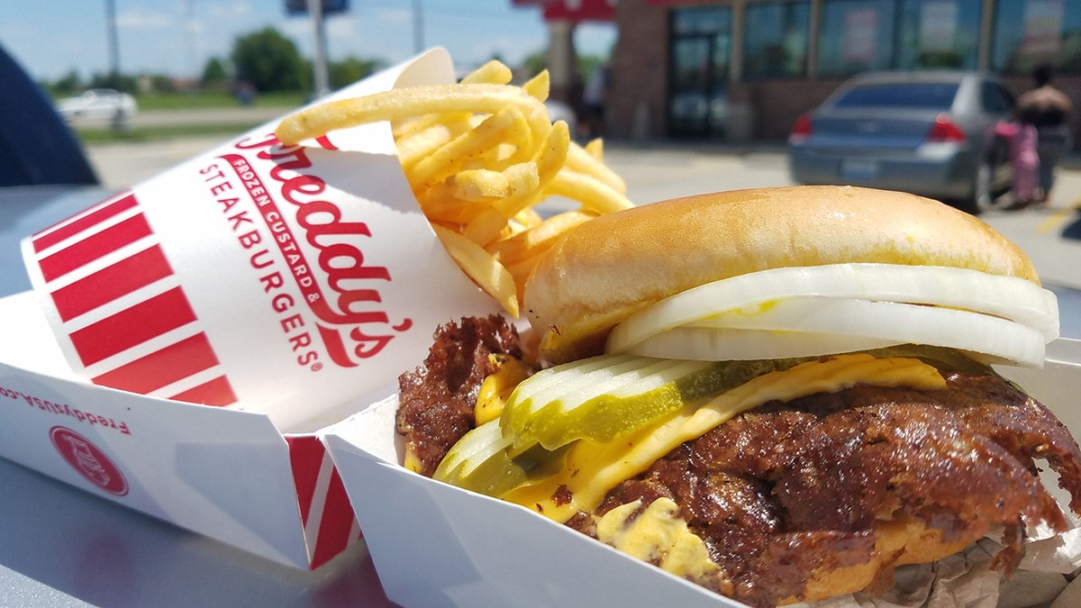 A Freddy's steakburger and fries are pictured outside one of the restaurants.