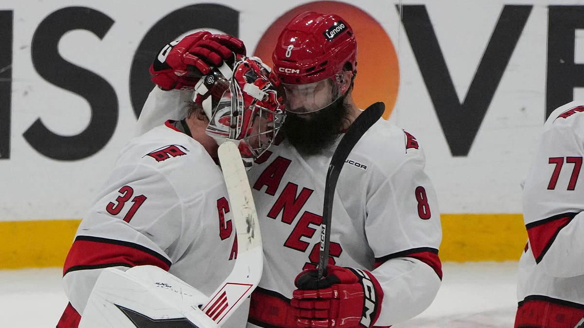 Frederik Anderson and Brent Burns embrace