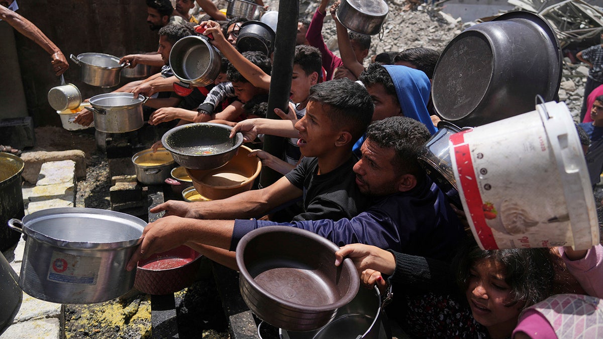 Palestinians line up for food in Gaza