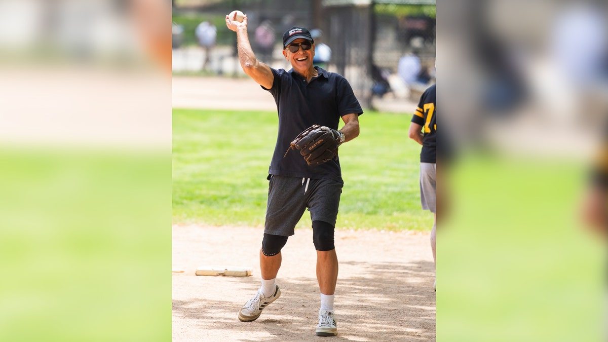 George Clooney throws a softball at game in New York